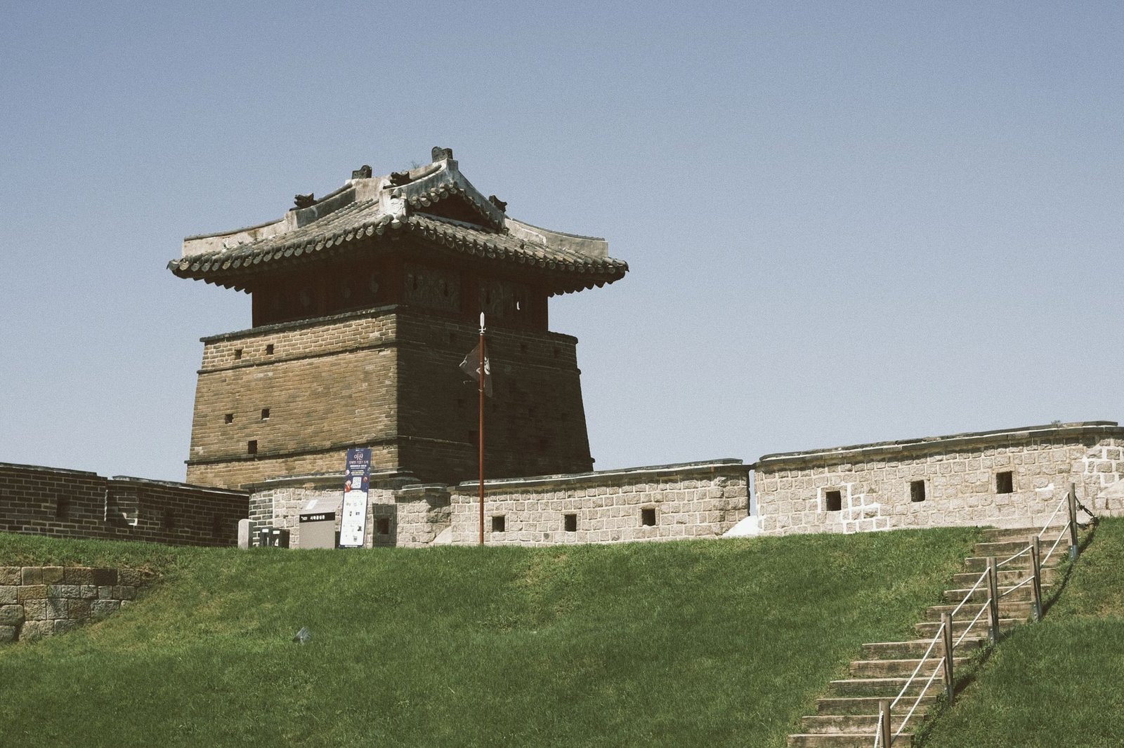 Ancient fortress with traditional Asian architecture under clear sky
