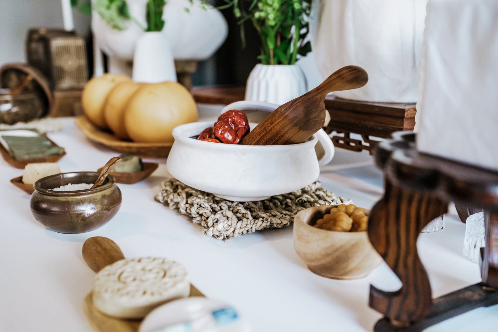 A beautifully arranged Korean table with traditional mooncakes and ceramic dishware