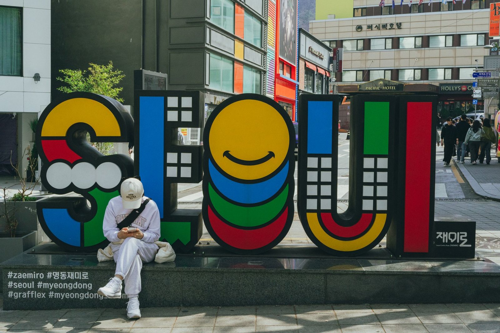 A vibrant Seoul sign in Myeongdong, South Korea, capturing the bustling street vibe