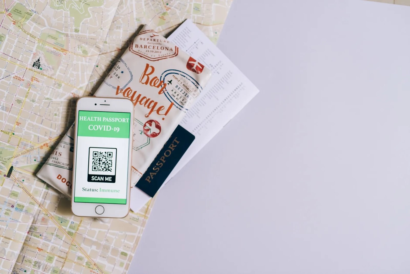 Smartphone displaying health passport with travel documents on a map, showcasing modern travel preparation