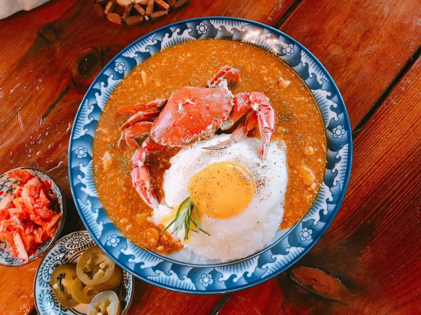 Delicious crab curry served with rice and a fried egg, shot in Jeju, South Korea