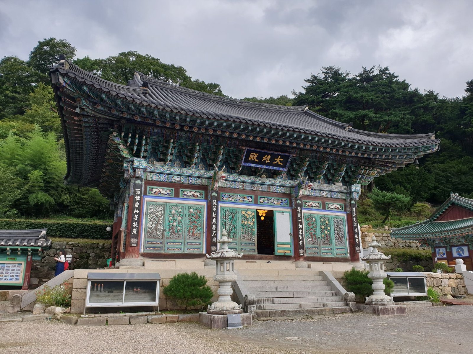 Vibrant Korean temple in lush Gangwon-do framing traditional architecture Vibrant Korean temple in lush Gangwon-do framing traditional architecture